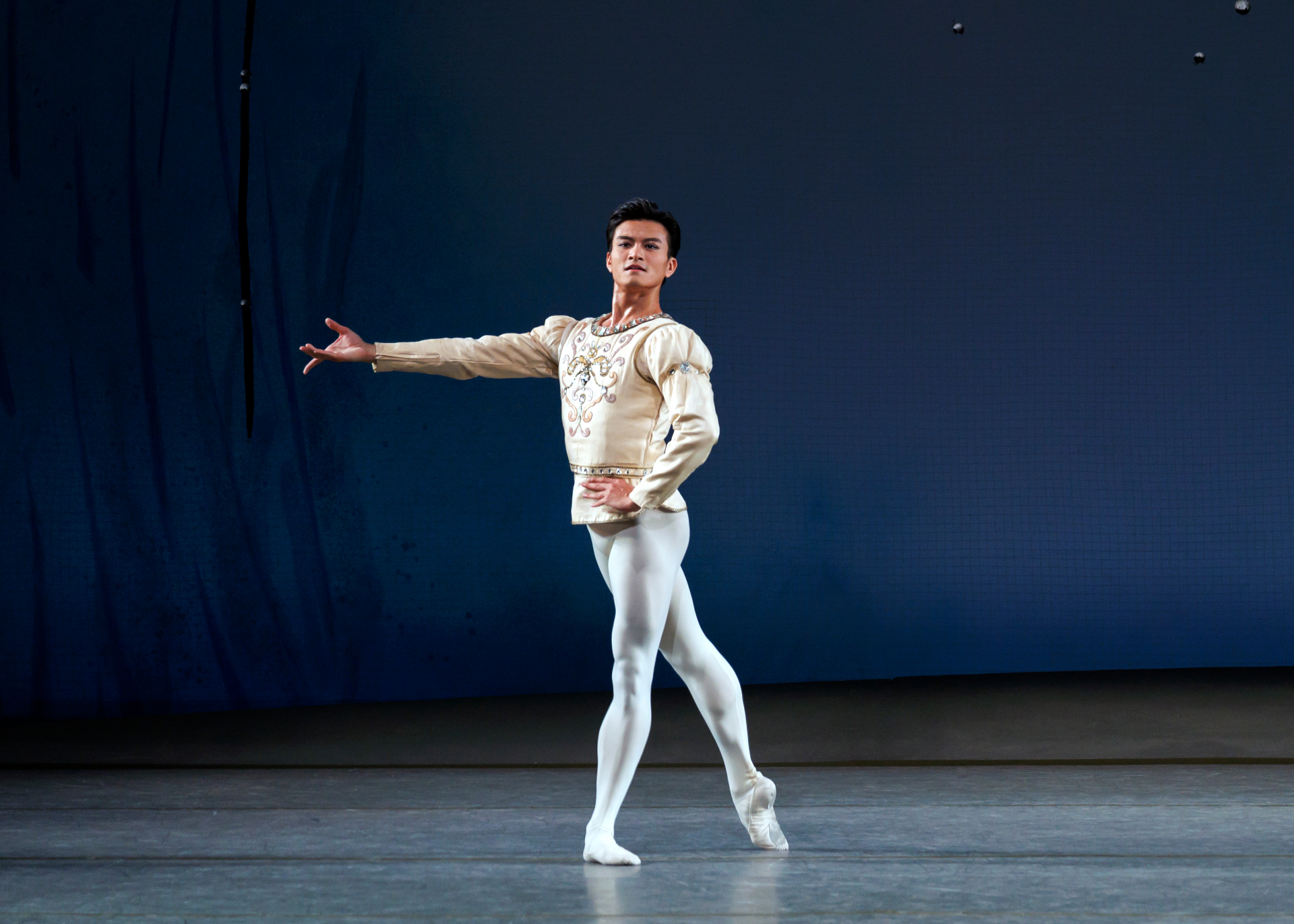Diamonds series — Diamonds — poised tendu with arm extended in cream and silver costume