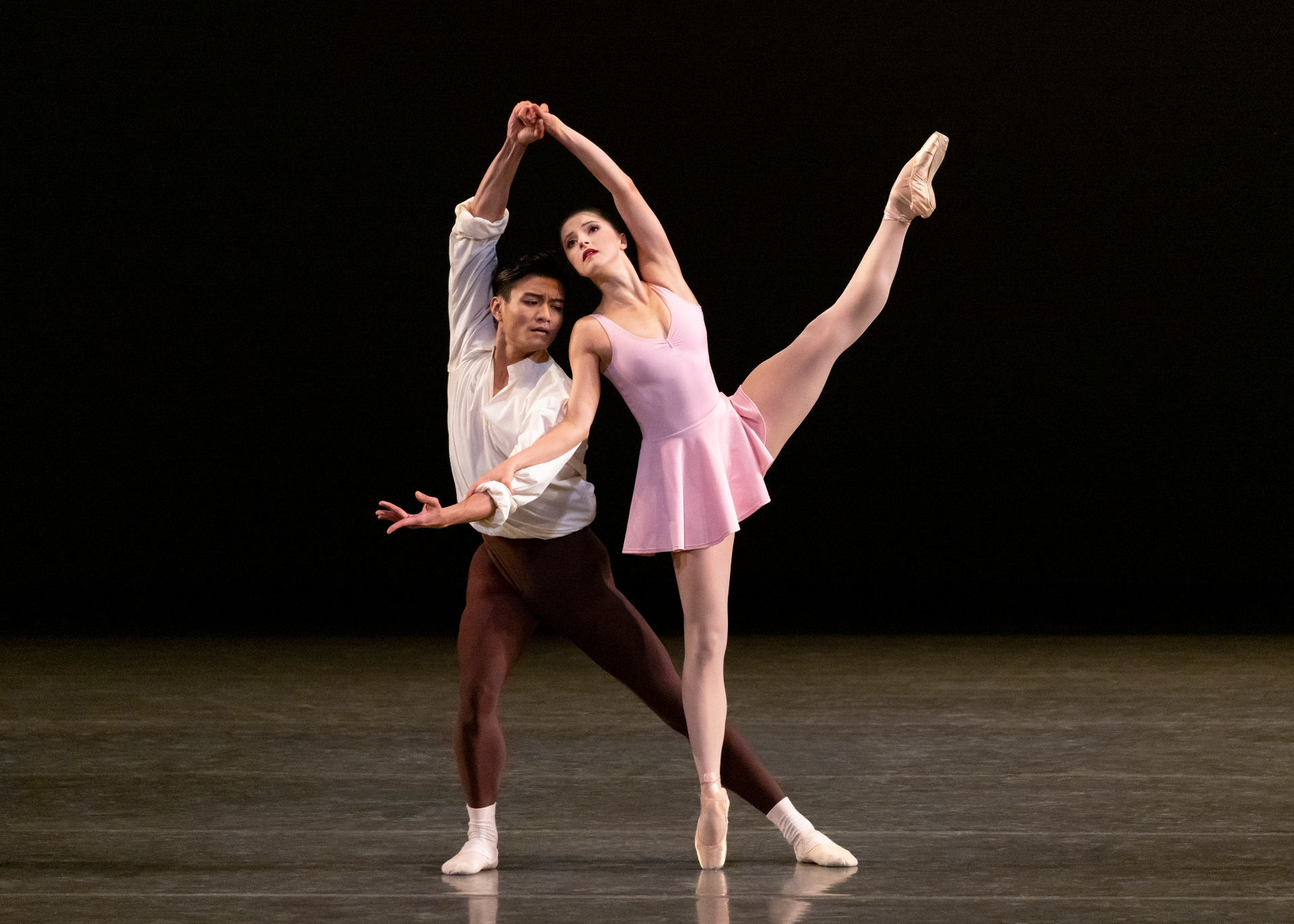 The Goldberg Variations series — The Goldberg Variations — partnered développé à la seconde with ballerina in pink leotard and cavalier in white shirt