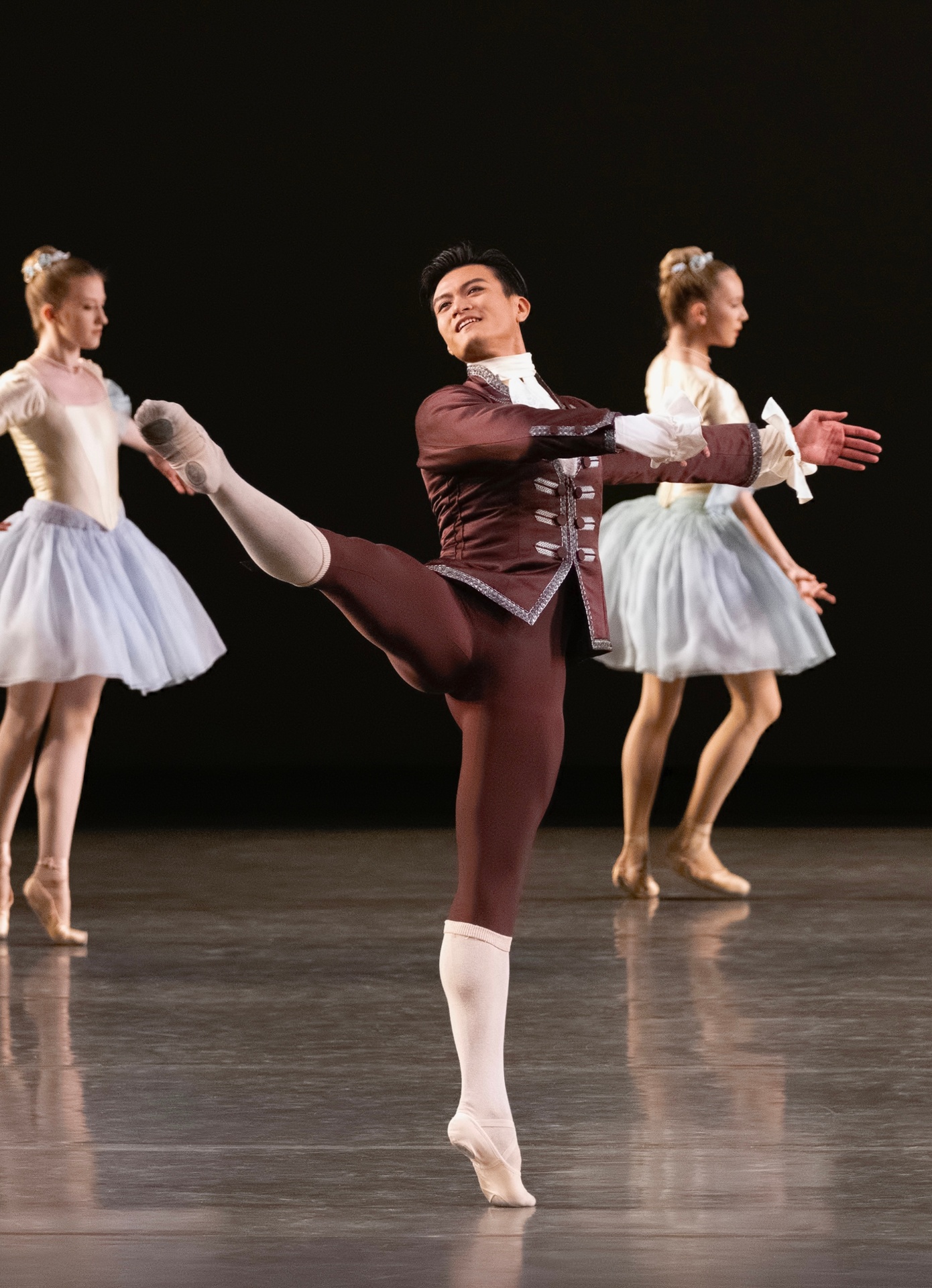 The Goldberg Variations series — The Goldberg Variations — solo with extended attitude in burgundy tunic flanked by corps in pastel tutus