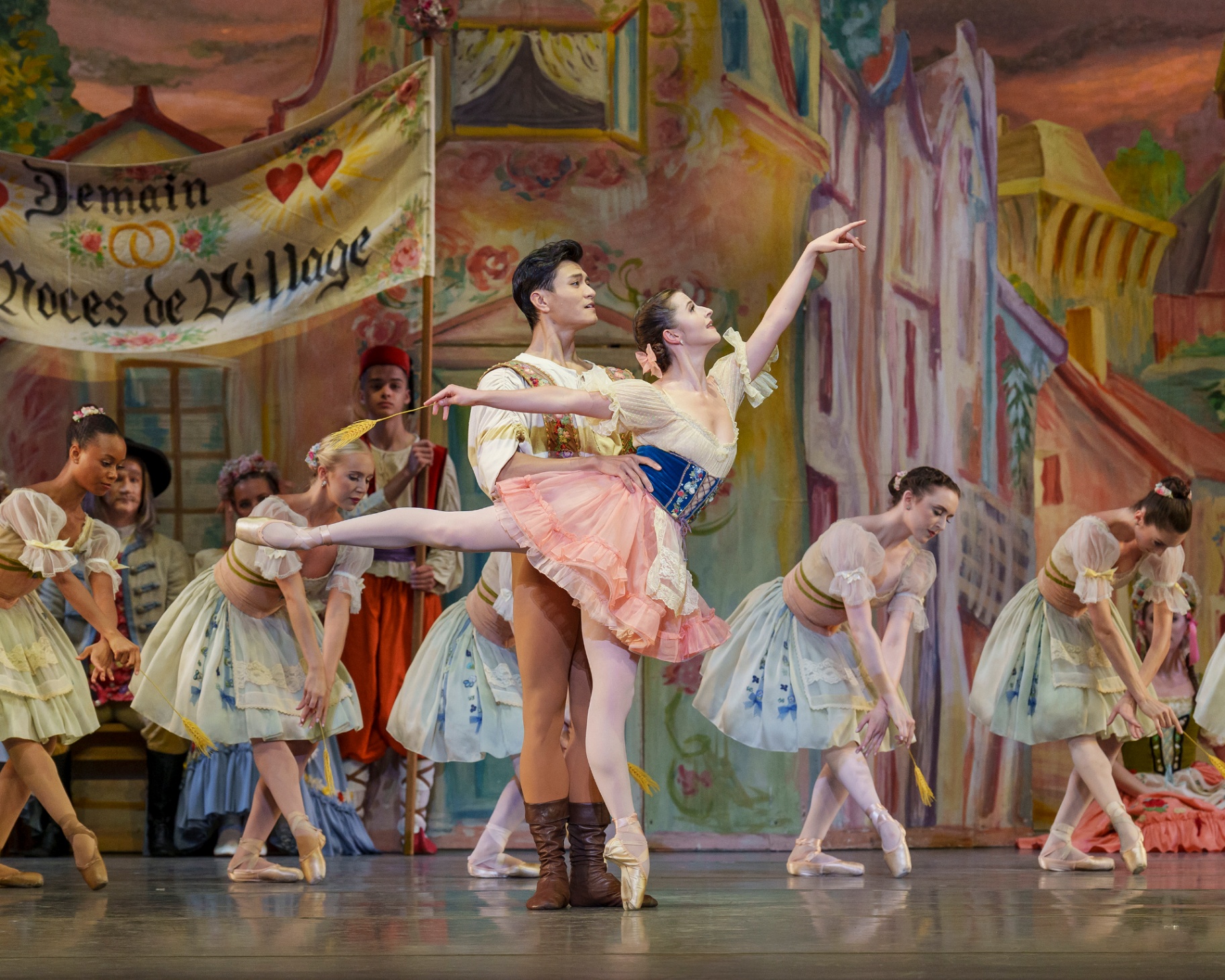Coppélia series — Coppélia — Act I pas de deux with Swanilda in pink and Frantz holding wheat sheaf before the painted village square